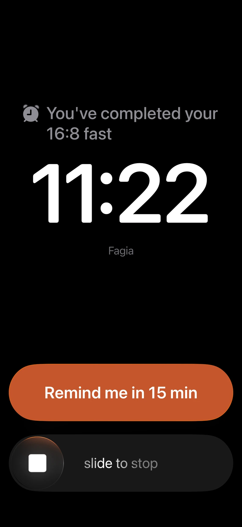 Fagia alarm after completing a 16:8 fast, with options to be reminded in 15 minutes or stop the alarm.