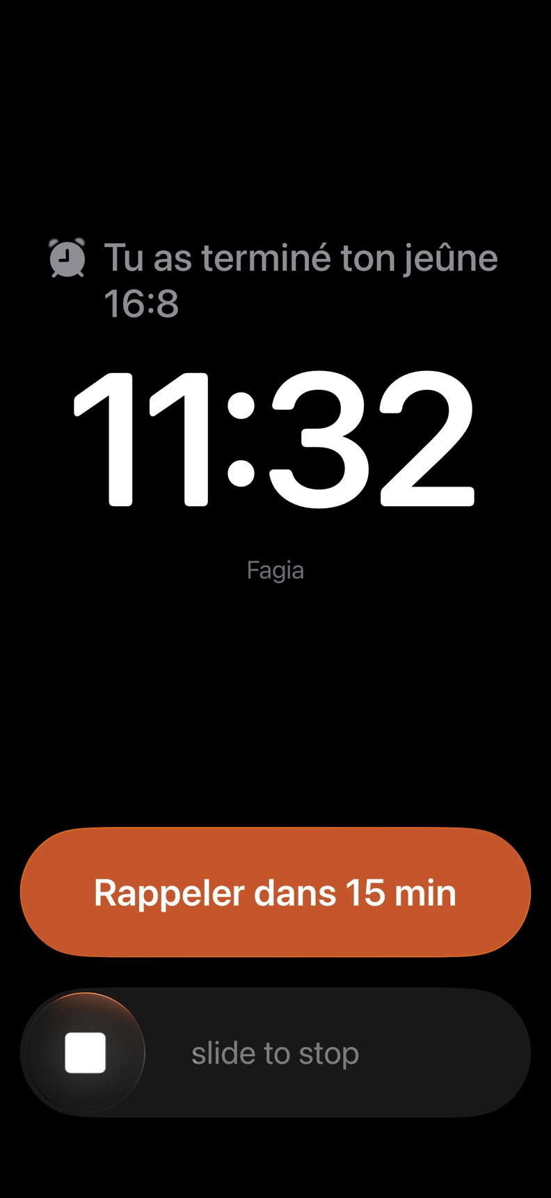 Alarme Fagia à la fin d’un jeûne 16:8, avec les options de rappel dans 15 minutes ou d’arrêt de l’alarme.